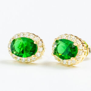 Green Gem Silver 925 Goldplated StudsOval emerald-like studs surrounded by gold.